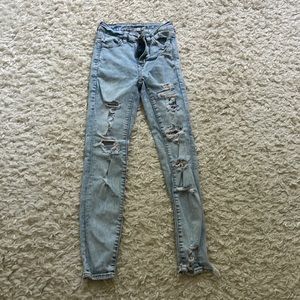 Size 000 American eagle light blue ripped jeans